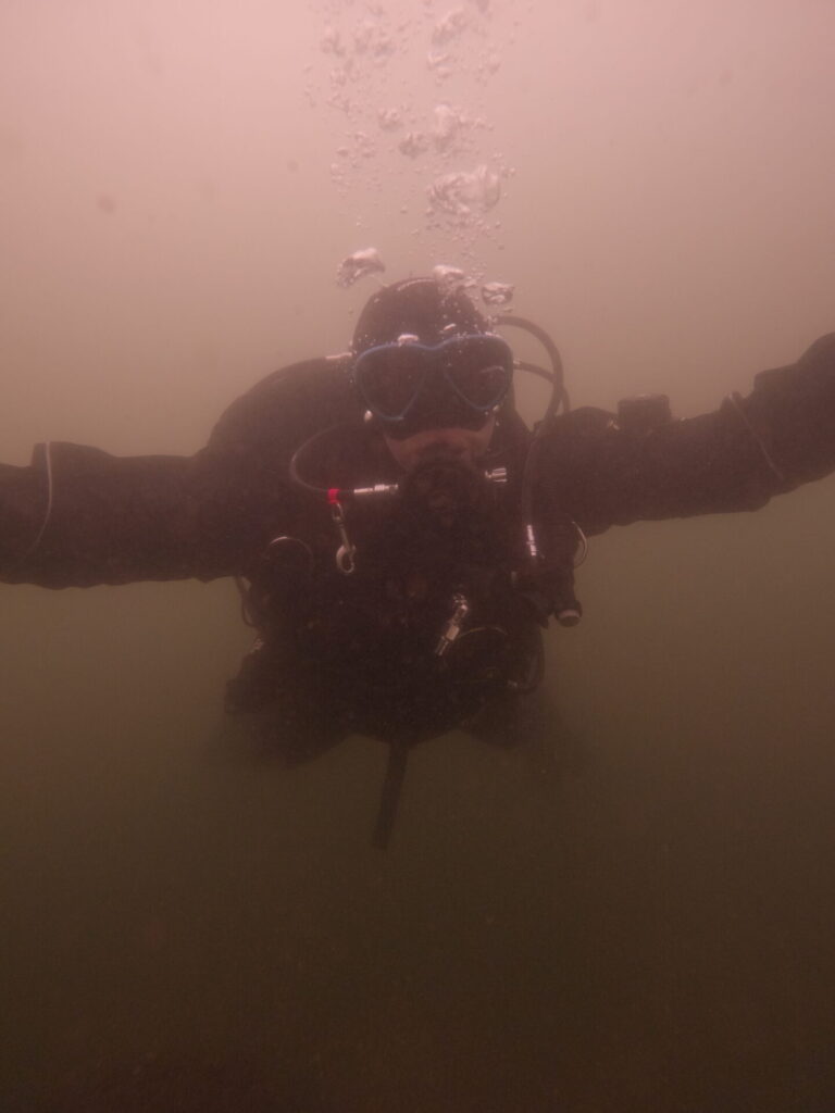 Happy diver diving in the camaro drysuit