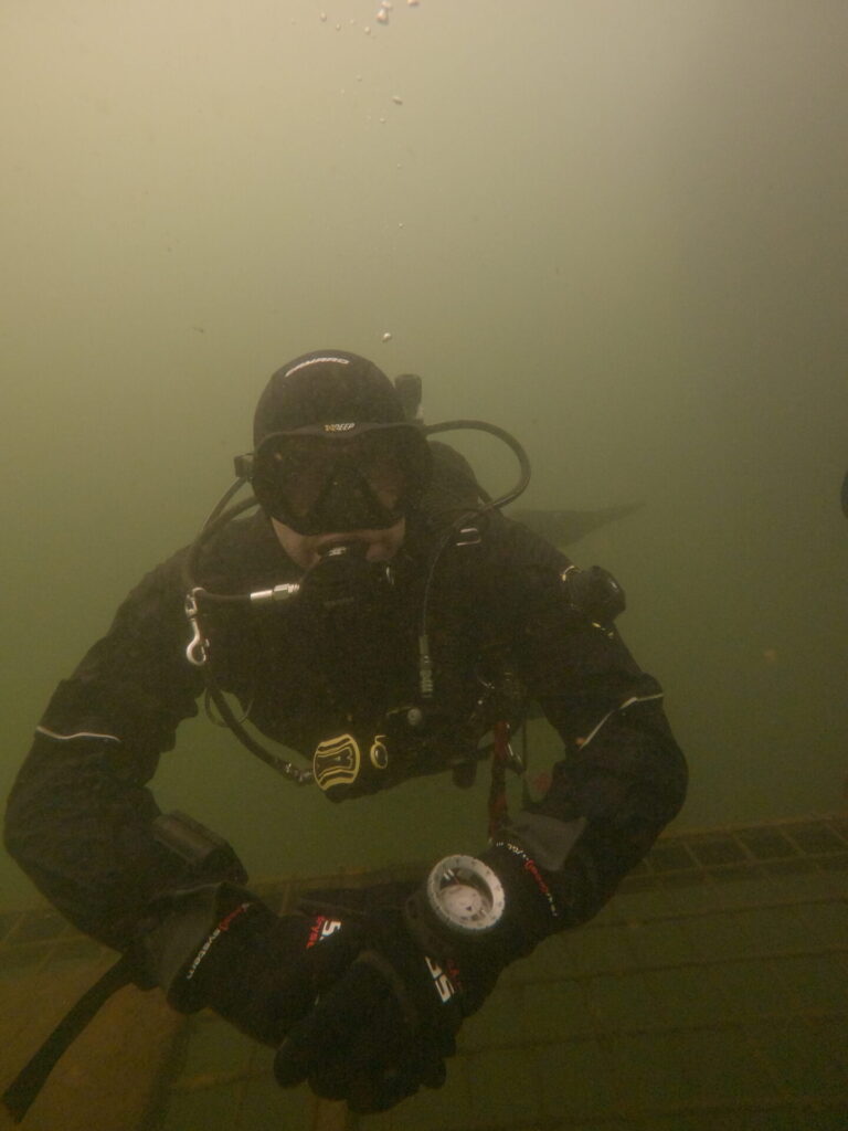 Diver in the Camaro drysuit hanging around