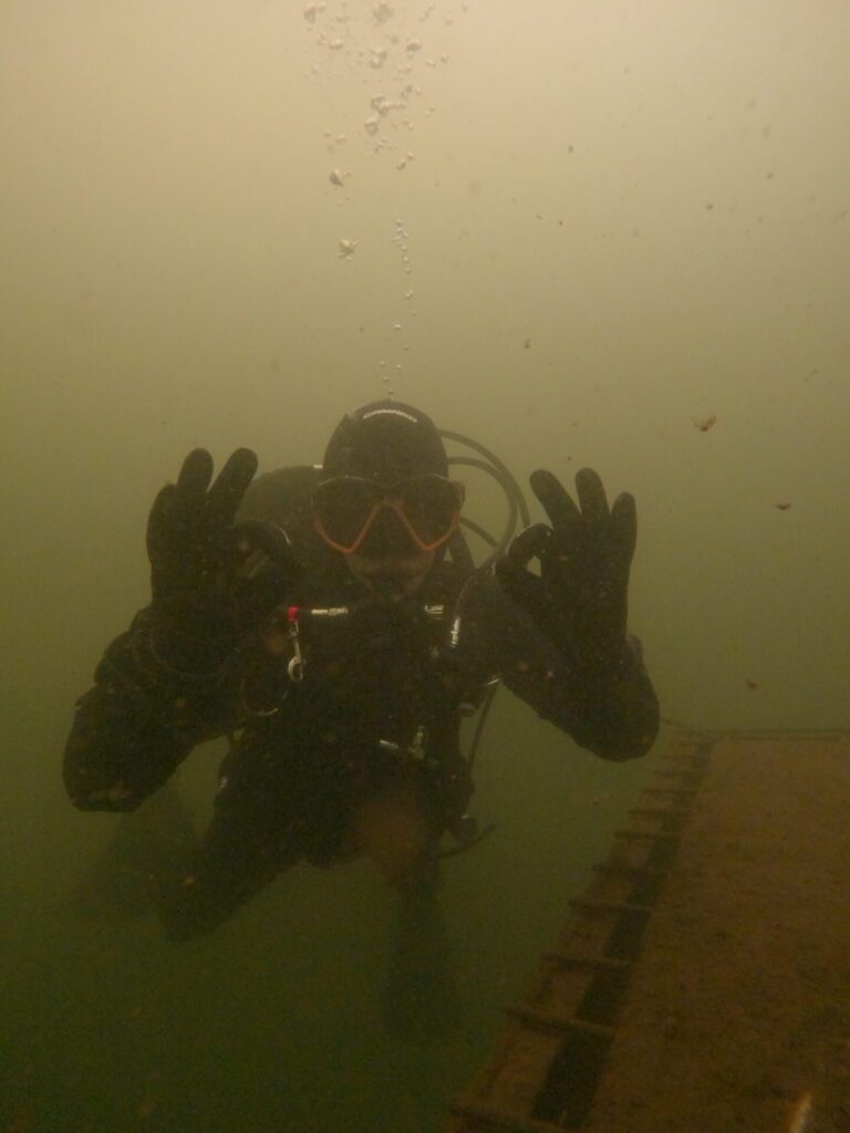 Diver hanging around with the camaro drysuit