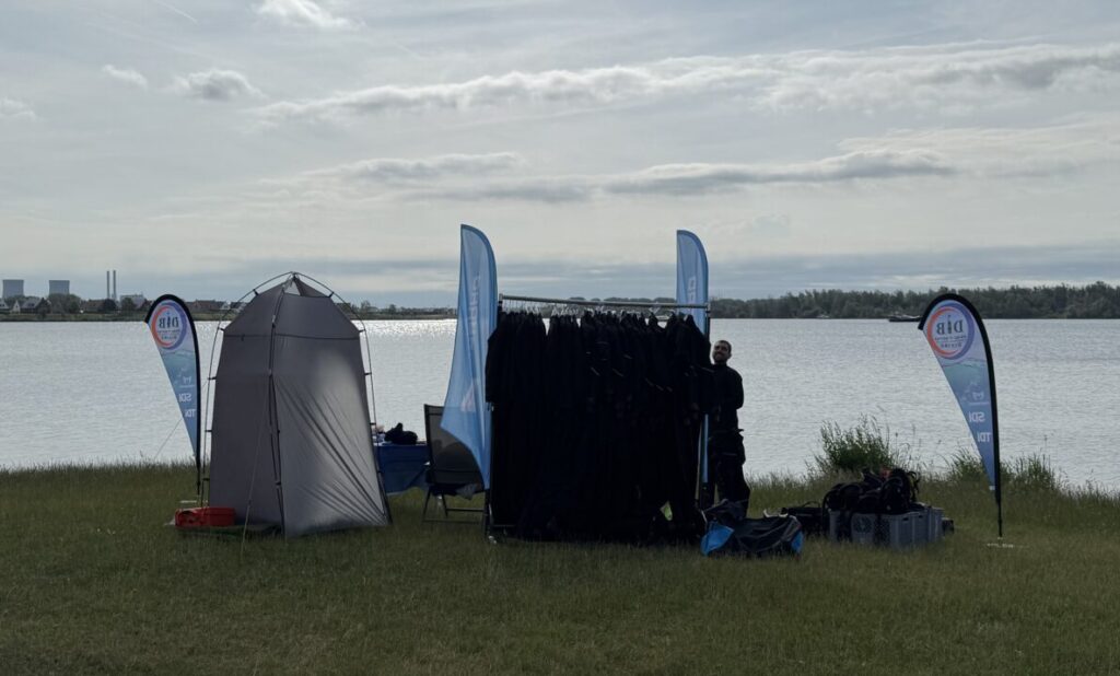 Gear all set up for the demo days, changing tent, drysuits on clothing rack