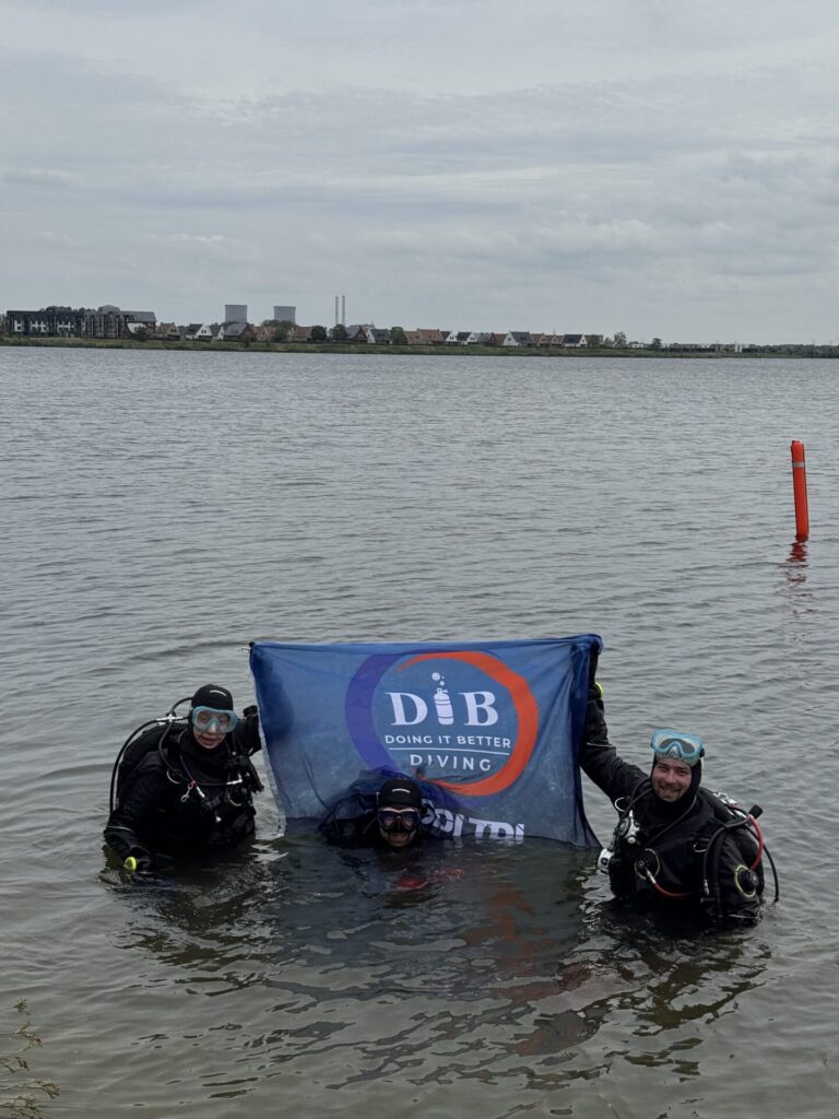 3 divers with the DIB Diving flag